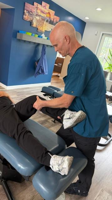 Dr. Dan Klein evaluating a patient with pain after knee replacement in Upper Darby, PA