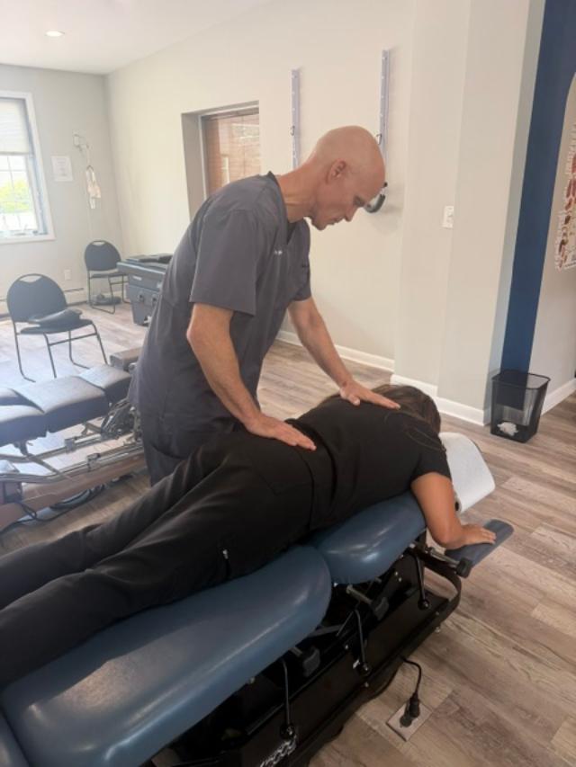 Dr. Dan Klein providing lower back chiropractic treatment in Upper Darby, PA