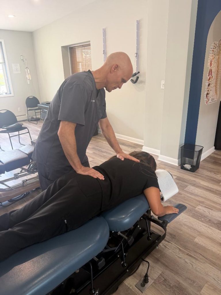 Dr. Dan Klein providing chiropractic care for lower back pain in Upper Darby PA